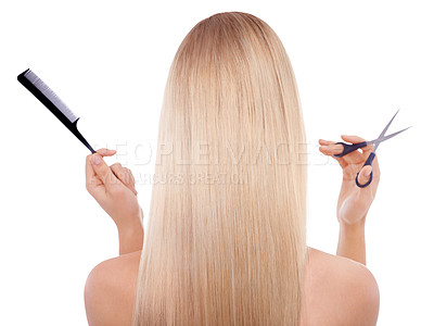 Buy stock photo Rearview shot of a blonde woman holding scissors and a comb