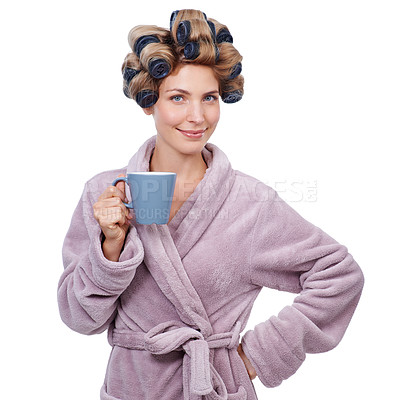 Buy stock photo Studio shot of a woman with curlers in her hair and wearing a robe drinking coffee
