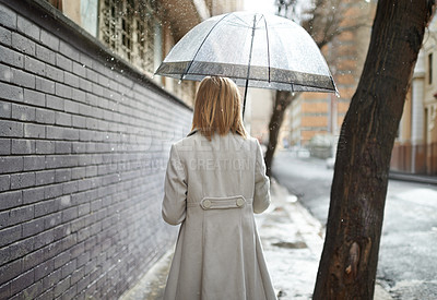 Buy stock photo Woman, umbrella and back in city for walking, cover and outdoor for urban commute in winter. Person, trench coat and holiday with fashion in metro street with buildings, journey and rain in Cape Town