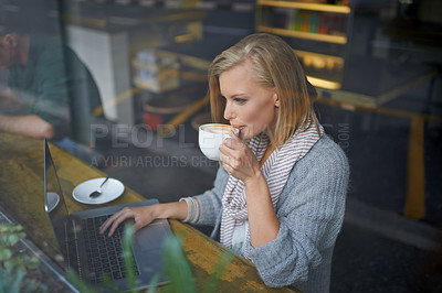 Buy stock photo Coffee shop, laptop and woman with drink in window online for internet, website and research. Restaurant, cafe and person on computer for freelance career, remote work and email with cappuccino