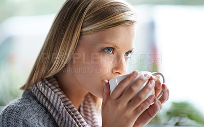 Buy stock photo A young woman sitting in a coffee shop