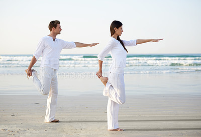 Buy stock photo Couple, yoga and balance, fitness on beach for zen and wellness, travel and mindfulness with holistic healing. People outdoor, exercise and pose, workout together for bonding with ocean and nature