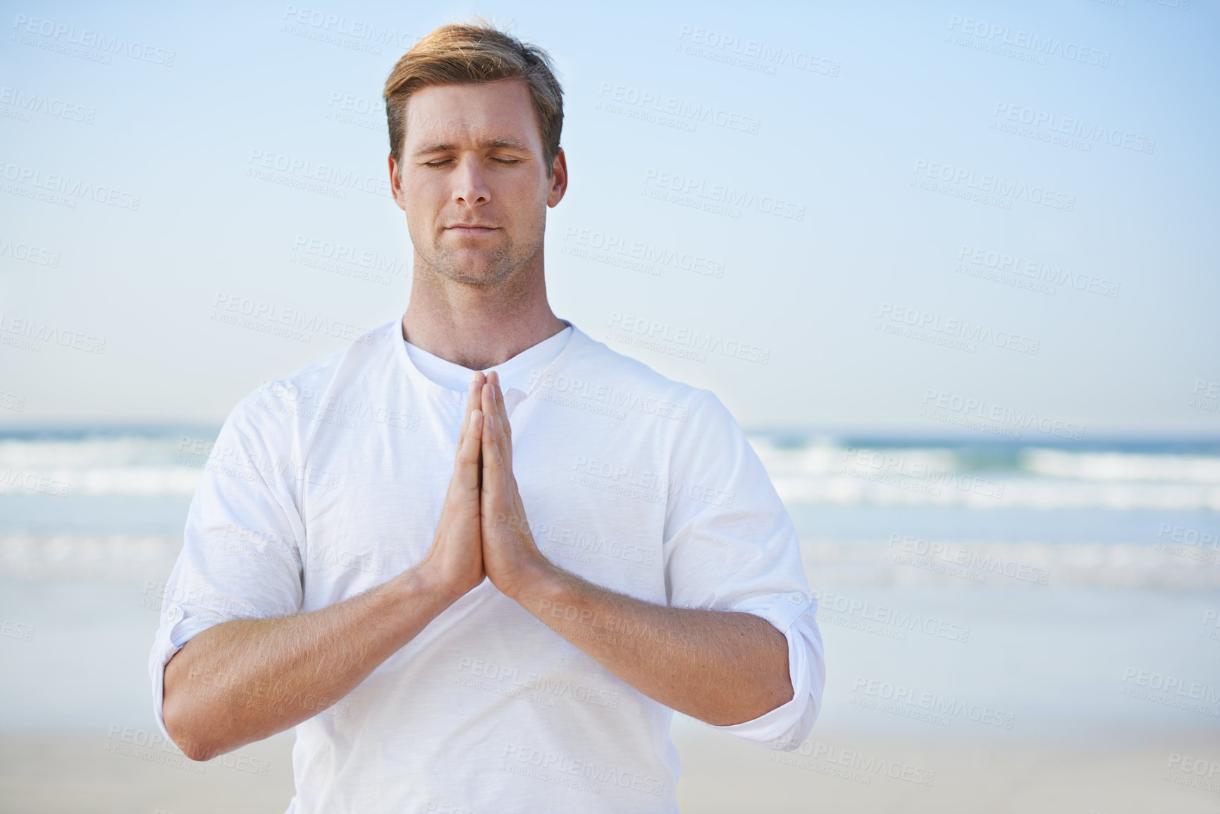 Buy stock photo Man, meditation on beach and prayer for zen, wellness and holistic healing outdoor for calm and yoga. Ocean, fresh air and travel with mindfulness for peace of mind, wellbeing and spiritual in nature