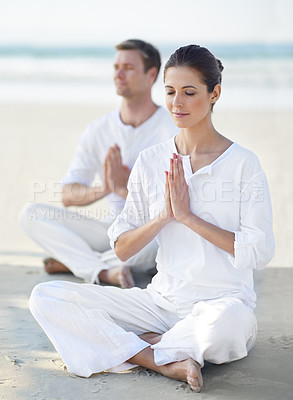 Buy stock photo Couple, yoga and sea with meditation, zen and waves on sand in morning with mindfulness in summer. Man, woman and outdoor for namaste with spiritual growth, balance and peace at beach in Cape Town