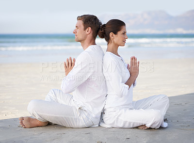Buy stock photo Couple, yoga and beach with meditation, sitting and peace on sand in morning with mindfulness in summer. Man, woman and outdoor for namaste with spiritual growth, balance or zen by ocean in Cape Town