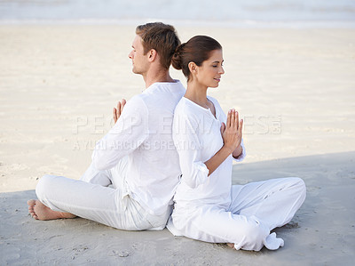 Buy stock photo Couple, yoga and beach with peace, sitting and meditation on sand in morning with mindfulness in summer. Man, woman and outdoor for namaste with spiritual growth, balance or zen by ocean in Cape Town