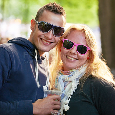 Buy stock photo Portrait, hug and couple with sunglasses, music festival and romance with sunshine and weekend break. Face, people and embrace with woman and man with summer and bonding together with funky eyewear