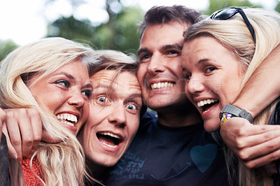 Buy stock photo Face, smile and hug with excited friends closeup outdoor in nature together for travel, festival or adventure. Party, energy or wow with man and woman group laughing in forest or woods in summer