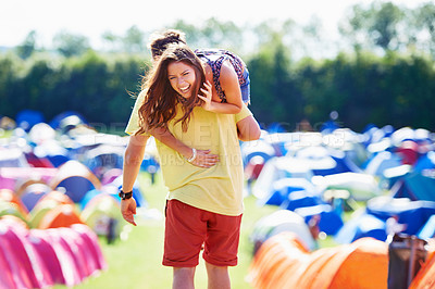 Buy stock photo Love, tent and carrying with couple laughing together outdoor on campsite for travel or vacation. Comic, nature or forest with funny young man and woman walking on grass for summer camping holiday