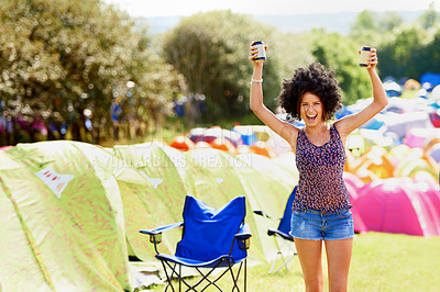 Buy stock photo Happy woman, excited outdoor and beer at festival, portrait for party or fun, cheers or celebration with arms raised. Freedom, dancing and alcohol drink in can, camping with tent or event in park