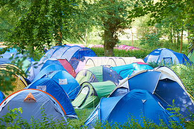 Buy stock photo Camping, tents and outdoor music festival in park on holiday or vacation in summer forest. Camp, site and shelter setup at party, event or travel in woods for concert, adventure and crowded carnival