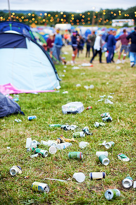 Buy stock photo Field, festival and litter with drinks, beer and beverage product for drinking a can in party. Concert outdoor pollution or alcohol on ground, grass or floor by trash or garbage with dirt or mess