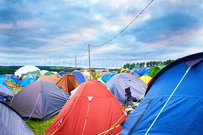 Buy stock photo Camping, tents and outdoor music festival in park on holiday or vacation in summer. Camp, site and shelter setup at party, event or travel in countryside for concert, adventure and crowded carnival