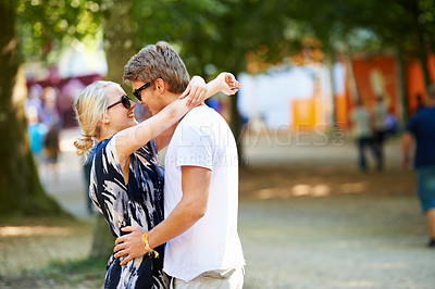 Buy stock photo Hug, outdoor or festival with couple, love and care in celebration of holiday romance or marriage. People, relax or man with woman or smile in relationship or summer for event, vacation or fun party