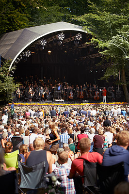 Buy stock photo Rearview shot of a crowd watching a band on stage