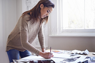 Buy stock photo Graphic designer, business woman and drawing on paper at desk with ruler for project in startup. Serious, creative and artist at table with sketch, planning or professional work on art with pencil