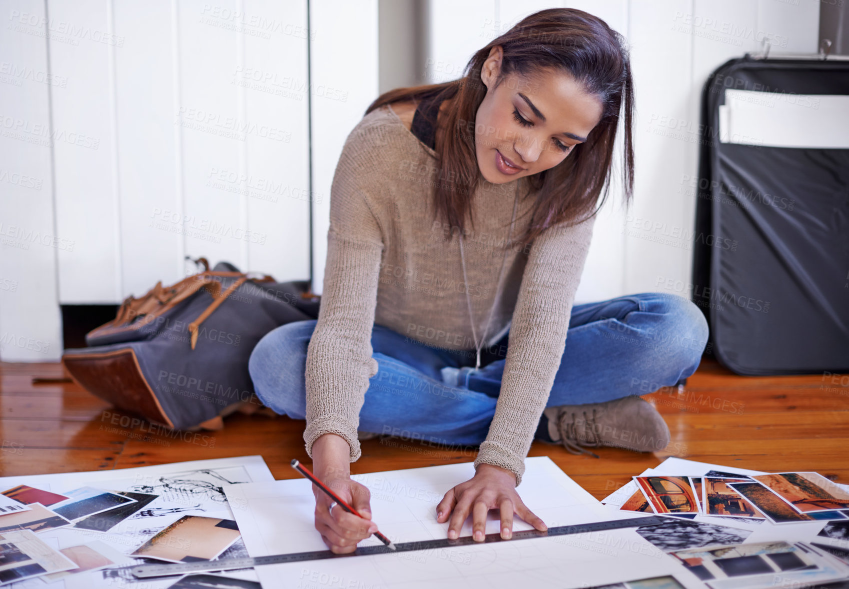 Buy stock photo A young woman working on her portfolio at home