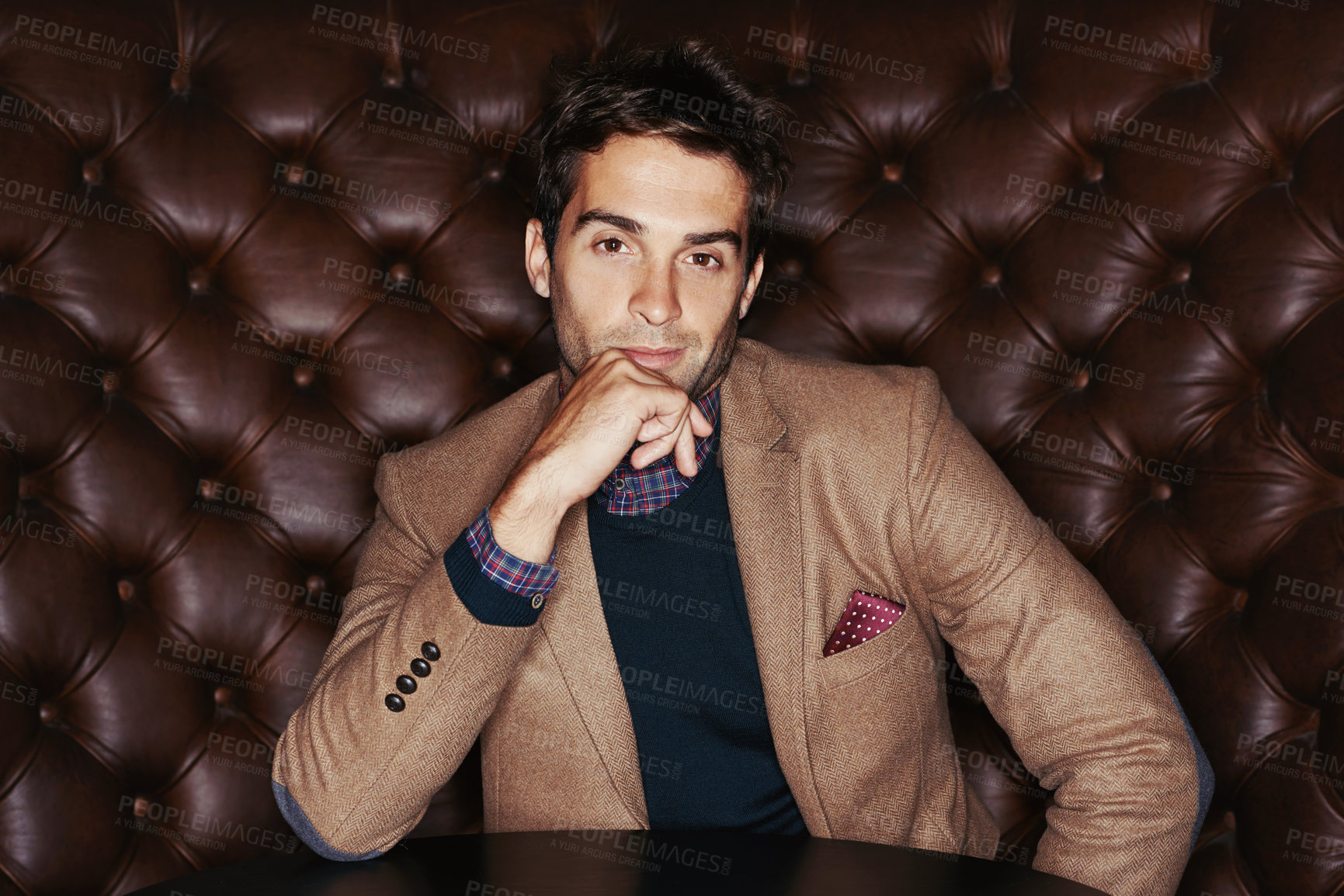 Buy stock photo Portrait of a stylishly dressed young man sitting in a lounge