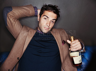 Buy stock photo Portrait, night and man in a club, alcohol and relax with event and confident guy with weekend break. Face, bottle and fashion with person and luxury with birthday celebration and expensive party