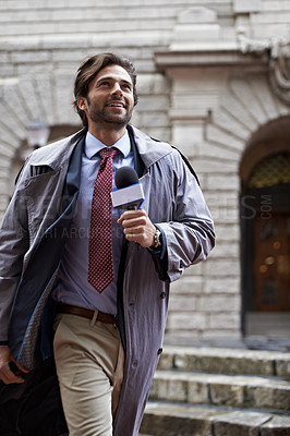 Buy stock photo Shot of a handsome young news reporter