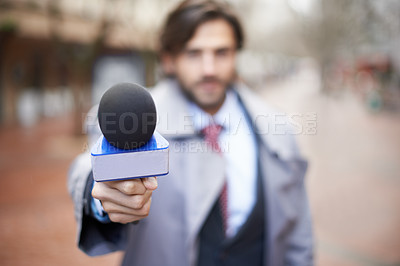 Buy stock photo Interview, man and hand with microphone for press, news broadcast or question in the city. Tv journalist, conversation and a male reporter with a mic for discussion, interviewing and work in media