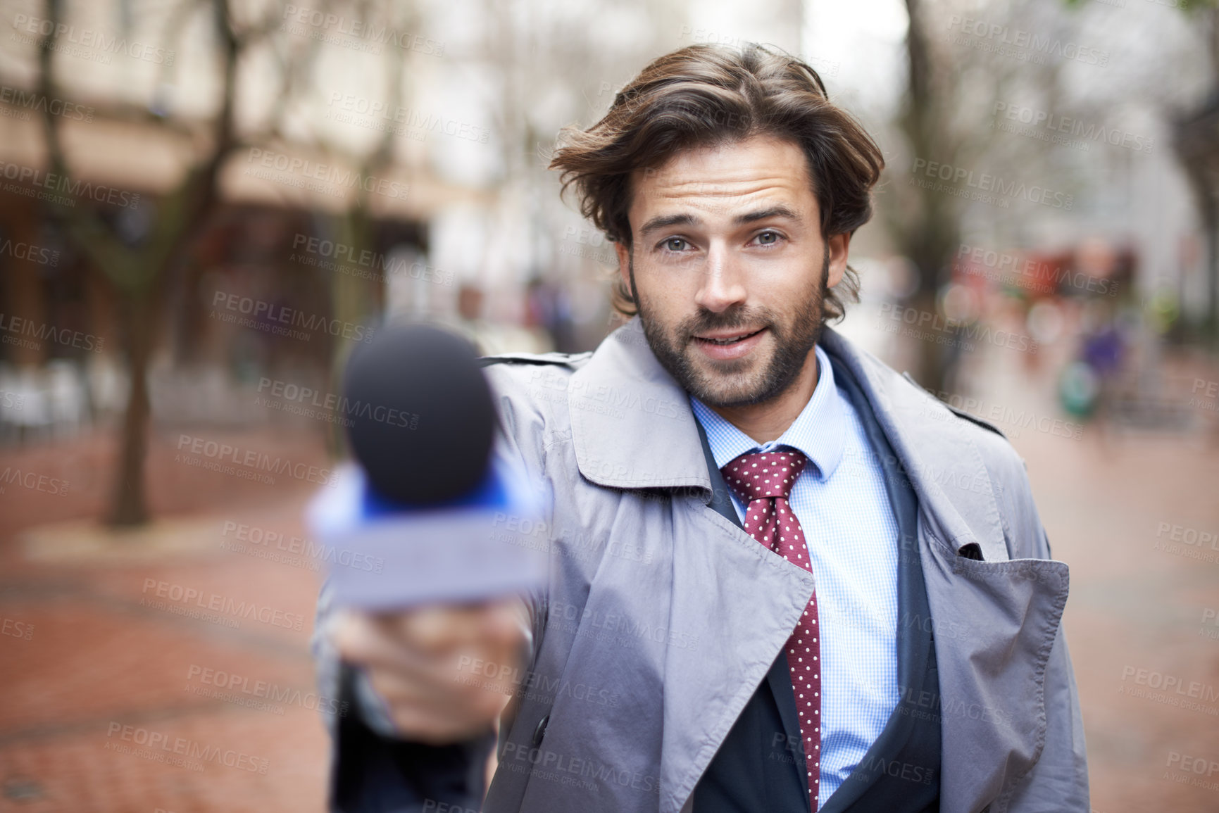 Buy stock photo Microphone, city and interview with man, reporting and live streaming with broadcast and journalism. Portrait, person and employee with questions and feedback with breaking news and mic with opinion