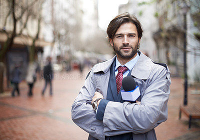 Buy stock photo Shot of a reporter ready to conduct an interview on the street