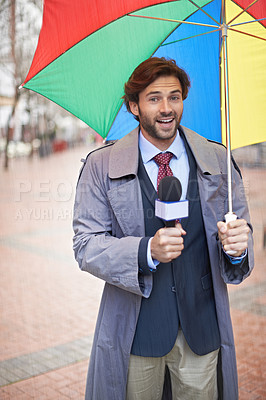 Buy stock photo Weather, man and reporting on rain, umbrella and journalism with media and anchor. Presenter, meteorology and person with microphone and professional in New York city with info and breaking news