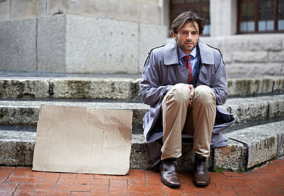 Buy stock photo Homeless, business or man with cardboard, unemployed in city or professional with recession or begging. Person, outdoor or financial criss with worker or stock market crash with job loss with poverty