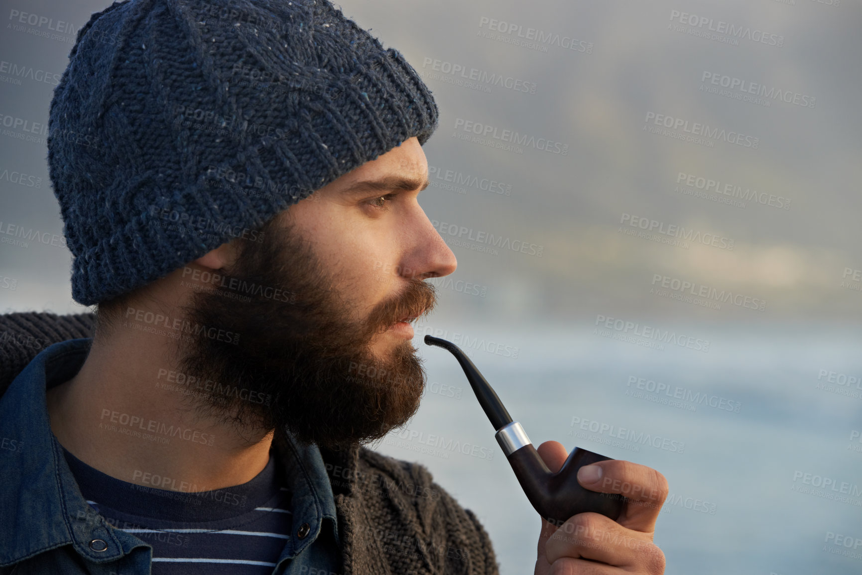 Buy stock photo View, man and smoking a pipe in nature, thinking and tobacco habit on winter morning for creative idea. English guy, nicotine and vintage smoker for planning, satisfaction and vacation in cape town