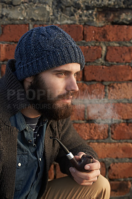 Buy stock photo Face, winter and pipe smoke with man outdoor on wall background for fashion, style or clothing. Morning, tobacco or habit and young person with beanie smoking in cold weather season to relax