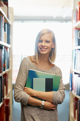 Buy stock photo Woman, library and books, portrait for education and knowledge with smile on campus. College student, bookstore and reading material for learning, happy with university and academic development