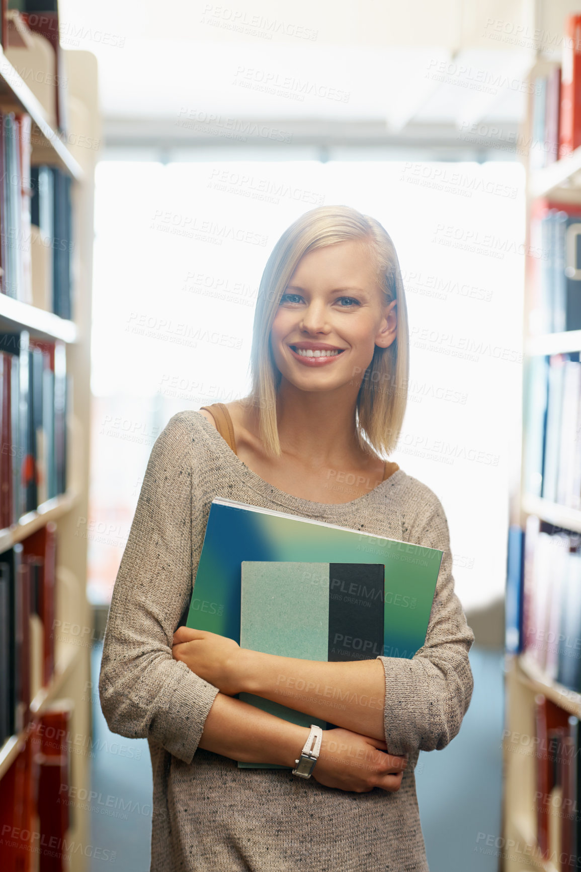 Buy stock photo Woman, library and books, portrait for education and knowledge with smile on campus. College student, bookstore and reading material for learning, happy with university and academic development
