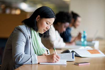 Buy stock photo Student, library and studying with book at desk for university or education for future, exam or scholarship. Asian person, writing and reading for college degree in Korea for school, campus or test