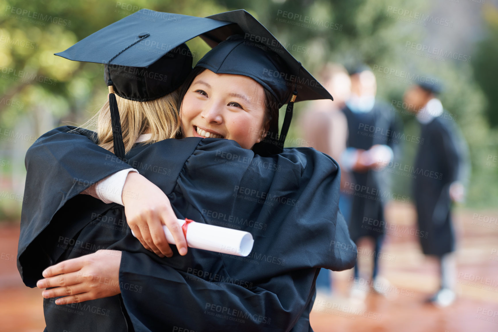 Buy stock photo Women, hug and graduation with celebration, ceremony and achievement with knowledge and success. Friends, university and students with education and embrace with support and certificate with diploma