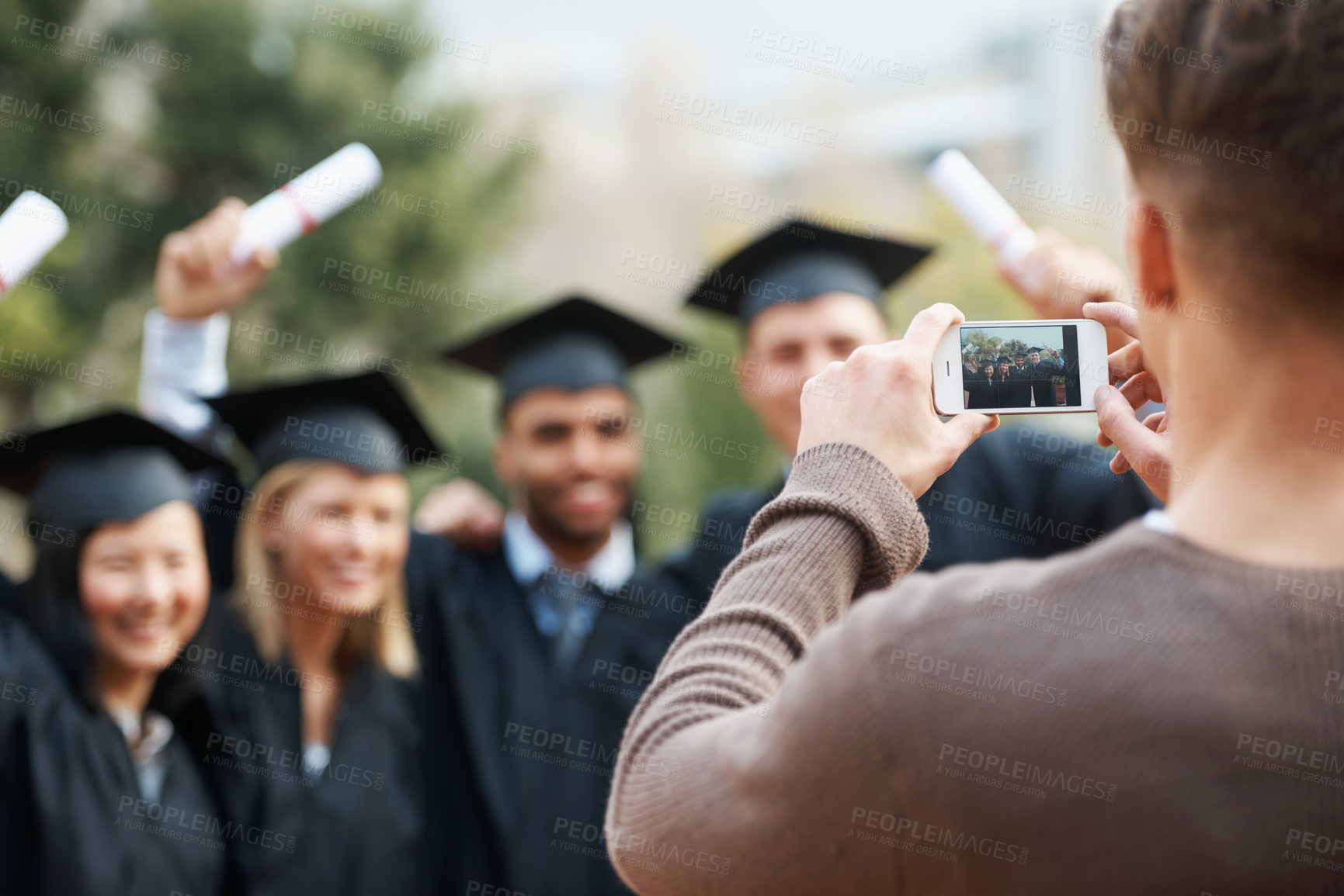 Buy stock photo Group, students and pose for picture, graduation and achievement with social media and excited. People, smartphone screen and friends with diploma and university with success, digital app and degree