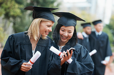 Buy stock photo Phone, friends or students in graduation, college or university to celebrate school diploma or degree. Mobile app, info or happy graduate women with education certificate, goal notification or news