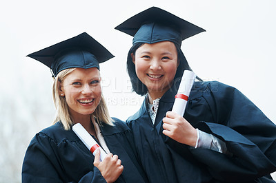 Buy stock photo Portrait, smile and graduation with student friends outdoor at overcast campus for certificate celebration. Face, education and success with college women at university for ceremony of tradition