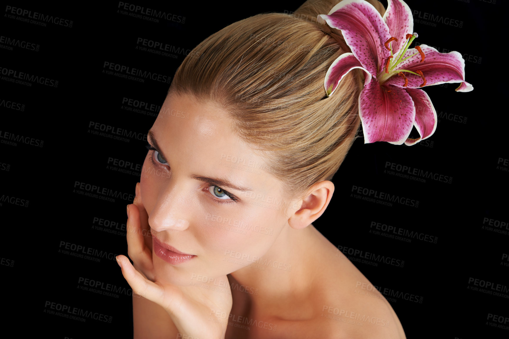 Buy stock photo Hair care, flower and woman touch skin, thinking and beauty isolated on a black studio background. Natural, floral makeup and hand of model in cosmetics, salon and lily for organic facial treatment