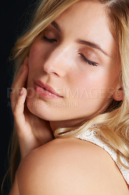 Buy stock photo Skincare, beauty and woman with eyes closed, glow and shine isolated on a black studio background. Face, hand and touch blonde model in makeup cosmetics, spa and facial treatment for smooth skin
