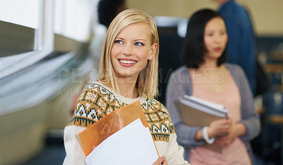 Buy stock photo University student, smile and thinking in college lecture with paperwork in USA for education, future or scholarship. Female person, documents and lesson hall with books for diploma, degree or phd