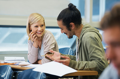Buy stock photo Conversation, college and students in classroom for studying with text book for test or exam. Discussion, writing and young friends work on university assignment together in lecture hall at academy.