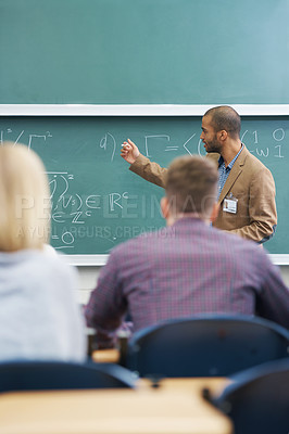 Buy stock photo Board, lecture and professor with students in classroom for mathematics lesson at university campus. Education, learning and college teacher explaining work or teaching for assignment, test or exam.