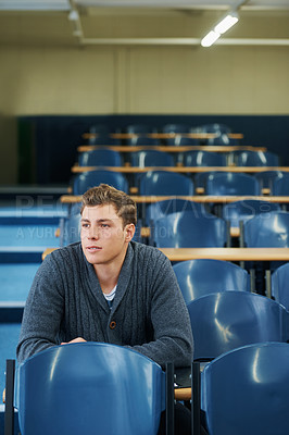 Buy stock photo Thinking, university and man student in classroom brainstorming for exam studying ideas. Planning, education and young male person in lecture hall with question for college assignment at academy.