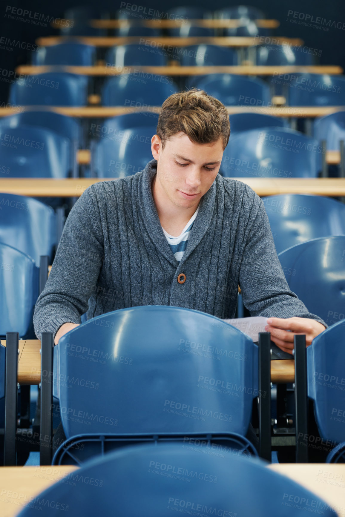 Buy stock photo Lecture hall, college and man with thinking, student and knowledge with exam and education. Person, writing and guy in classroom with test and learning with studying and creativity with research