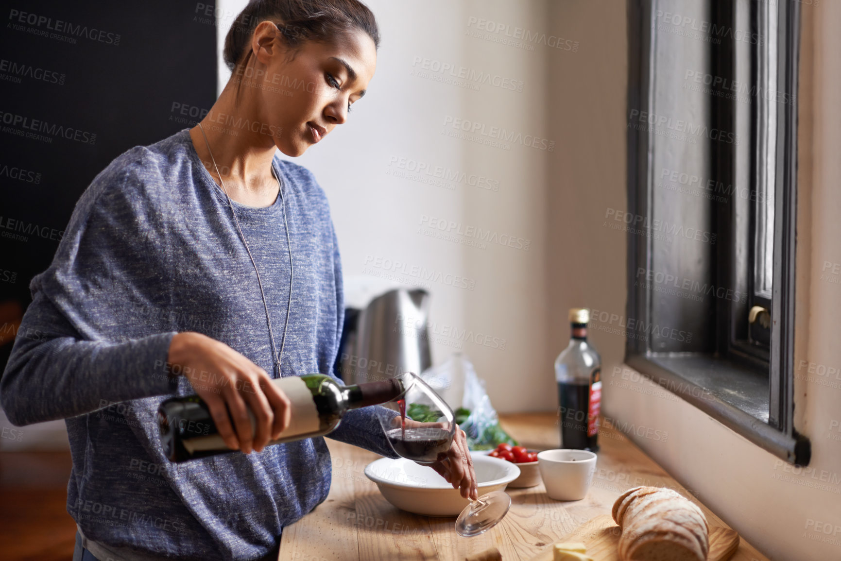 Buy stock photo Woman, pour wine and home for dinner, relax for peace and leisure with drink in kitchen. Alcohol, glass and bottle with refreshment, hydration with beverage to celebrate or chill in apartment
