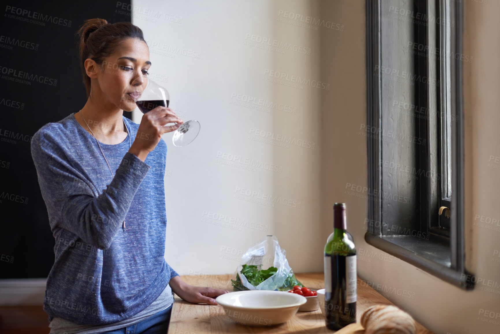 Buy stock photo A young woman drinking wine