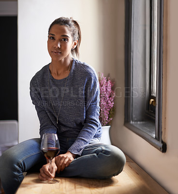 Buy stock photo Wine, glass and portrait of woman in home to drink and relax in kitchen at the window. Serious, person or alcohol on counter in living room of house for calm weekend, holiday or vacation in apartment