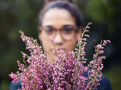 Buy stock photo Woman, face and flowers as gift outdoor in nature for gardening in spring and plant for harmony. Peace, backyard and home to calm person with present of fresh bouquet in purple to relax and enjoy