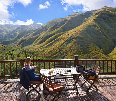 Buy stock photo Woman, nature and eating on a balcony for holiday, vacation and travel destination at a countryside hotel or lodge. Person with breakfast, food and thinking of mountains or view on eco friendly patio